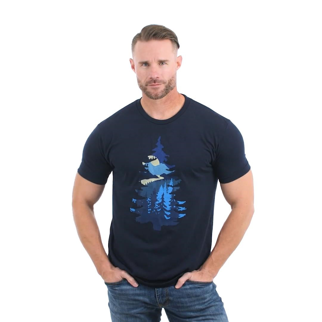 Made in the USA ultra-comfortable Relaxed Fit T-Shirt with a blend of premium materials, ensuring durability, breathability, and a luxuriously soft feel. Featuring a large nighttime landscape graphic, all contain inside a pine tree silhouette. Model Fit Video.